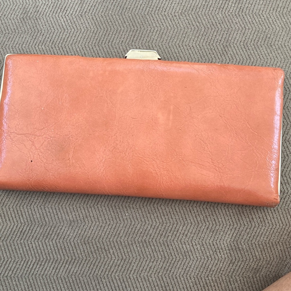 Mundi Slim Wallet holds money or credit cards. Never used. Slight discolor Orang
